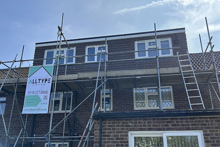 Completed dormer loft conversion with scaffolding still in place.