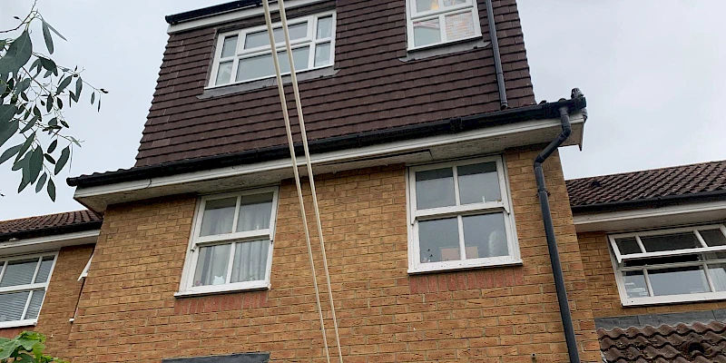 Exterior view of a completed dormer loft conversion, showcasing a modern roof extension with large windows that allow for plenty of natural light. The stylish design seamlessly integrates with the existing building, offering a spacious and functional addition to the home.